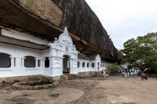 Dambulla, Sri Lanka - August 15, 2018: People in front of the Dambulla Cave Temple also known as the Golden Temple