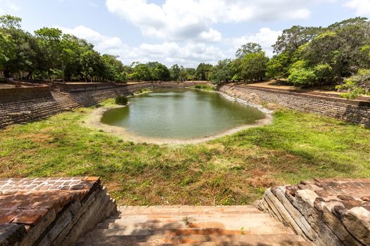 Anuradhapura, Sri Lanka - August 21, 2018: The Elephant Pond, Eth Pokuna in the ancient city. It's the largest man-made pond at the UNESCO site of Anuradhapura.