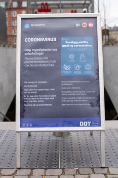 Copenhagen, Denmark - March 17, 2020: Sign at Nuuks Plads metro station informing about the coronavirus.
