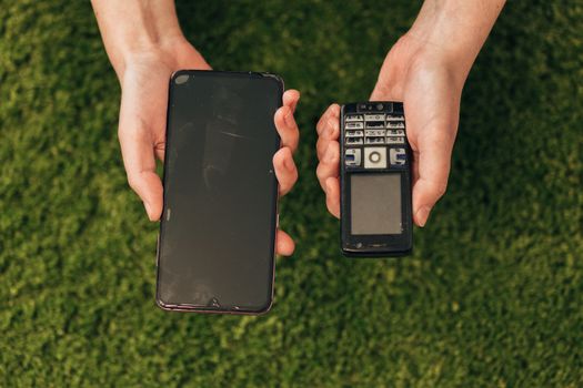 The Human Hand Choosing Phone That Lies Near New Smartphones.