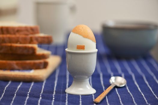 Conceptual Boiled egg lookalike Hitler hair and moustache