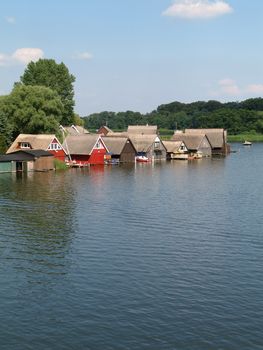Lake Mueritz with thatched boathouses in Mecklenburg-Western Pomerania, Germany.