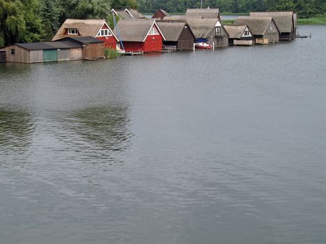 Lake Mueritz with thatched boathouses in Mecklenburg-Western Pomerania, Germany.