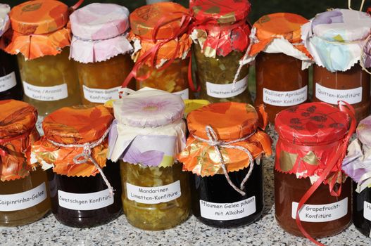 Jam in small jars with wrapping paper and ribbon.