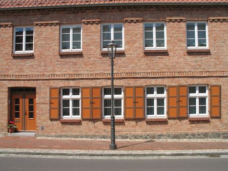 Exterior view of a beautiful house with shutters in Roebel, Mecklenburg-Western Pomerania, Germany.