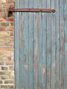 Weathered wooden door in Malchow, Mecklenburg-Western Pomerania, Germany.