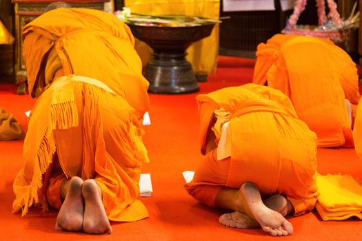 Wat Phra That Chang Mai Thailand 12.9.2015 monks praying golden Buddhist temple . High quality photo