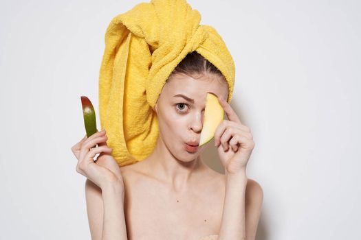 cheerful woman yellow towel on her head mango diet food vitamins health. High quality photo