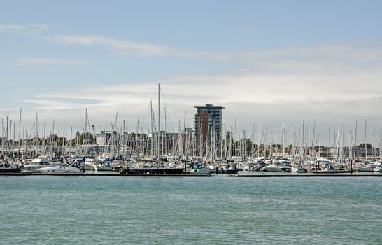 Gosport, UK - September 8, 2020: View across Portsmouth Harbour towards Weevil Lake, Gosport Marina and the new Rope Quays housing development on a sunny summer day.