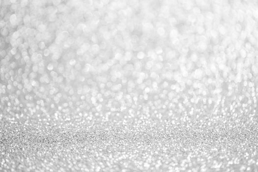 Shiny silver bokeh glitter lights abstract background, Christmas New Year party celebration concept