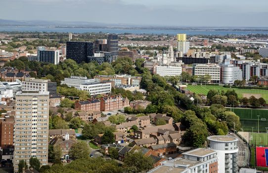 Aerial view across Portsmouth City Centre on a sunny summer day in Hampshire.  View includes the University and the yellow clad Greetham Street Student Halls known locally as the 'Fag Butt'.  