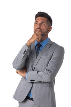 Portrait of handsome business man in gray suit thinking holding hand on chin studio isolated on white background