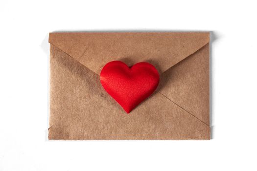 Valentine day love letter, envelope of craft paper with red heart isolated on white background