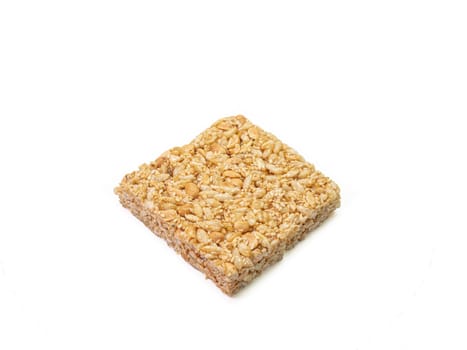 The close up of homemade Thai sweet cereal bar candy on white background, traditional muesli food in thailand.