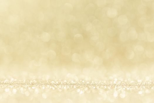 Shiny golden bokeh glitter lights abstract background, Christmas New Year party celebration concept