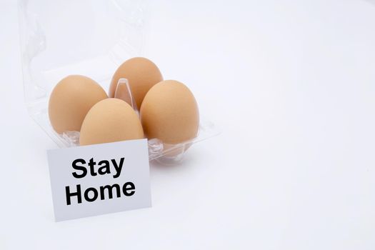 Easter egg with text stay home for protective covid-19 isolated on white background, social distancing and quarantine, stocking up on food for while pandemic coronavirus, easter day concept.