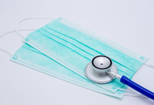 Face mask for protective epidemic covid-19 and stethoscope isolated on white background, equipment for protect outbreak of coronavirus, safety and hygiene, prevention for bacteria and allergy.