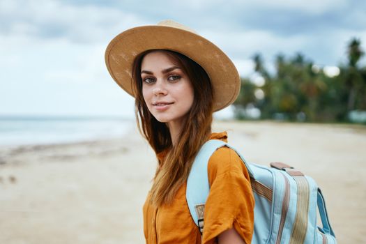 blue backpack beautiful woman wearing hat island travel young tourist model