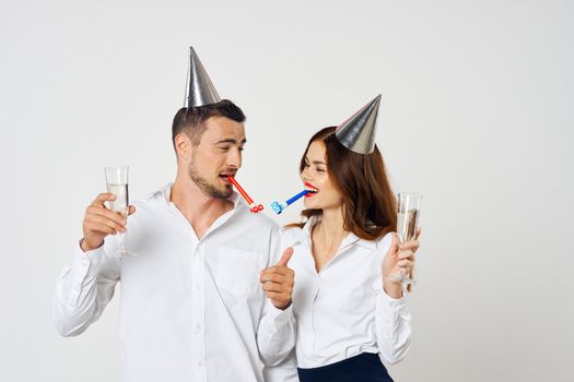 Birthday holiday young couple white shirts champagne Christmas fun corporate party