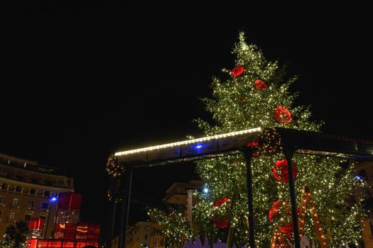 Night view of illuminated festive instalments at southern part of main city square.