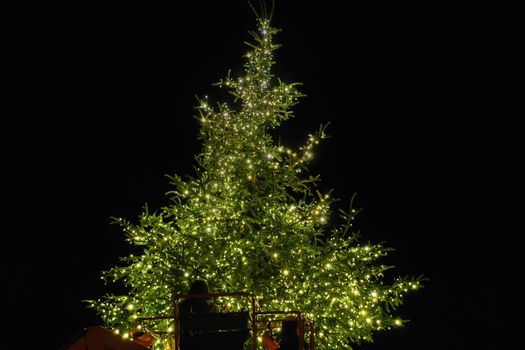 Night view of festive instalments with lit bulbs on a big pine at Aristotelous square in Thessaloniki, Greece.