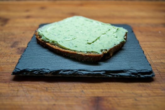 a delicious fresh bread with herb cream for the breakfast