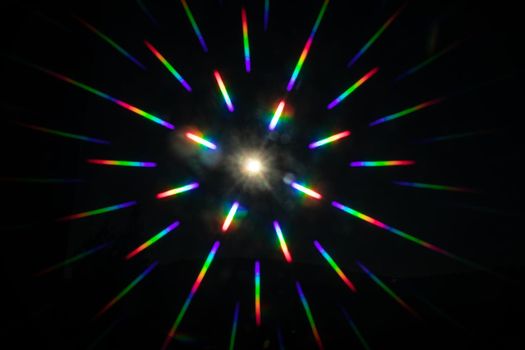 punctiform light source reflects the colors of the rainbow in all directions