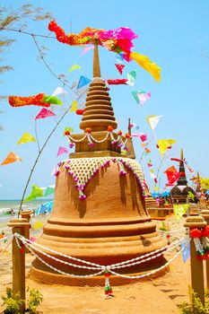 Giant sand pagoda and colorful flags was carefully built, and beautifully decorated in Songkran festival