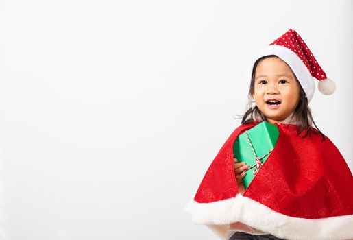 Kid dressed in red Santa Claus hat hold gift box