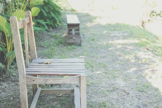 old wooden chair in garden