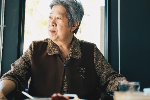 old asian elderly senior elder woman feeling bored