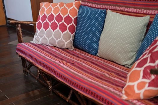 sofa with red pillow cushion in living room