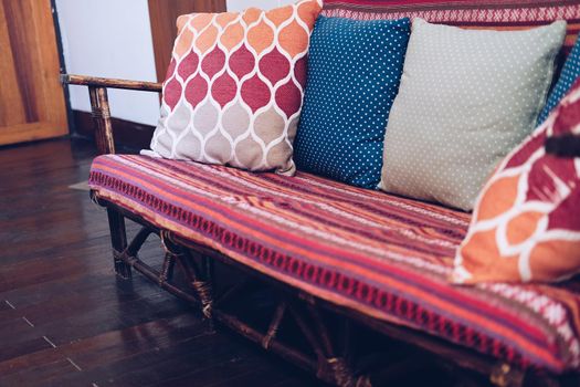 sofa with red pillow cushion in living room