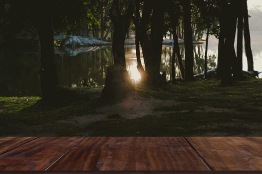 morning sunlight on lake pond in park.