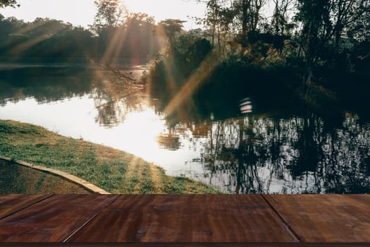 morning sunlight on lake pond in park.