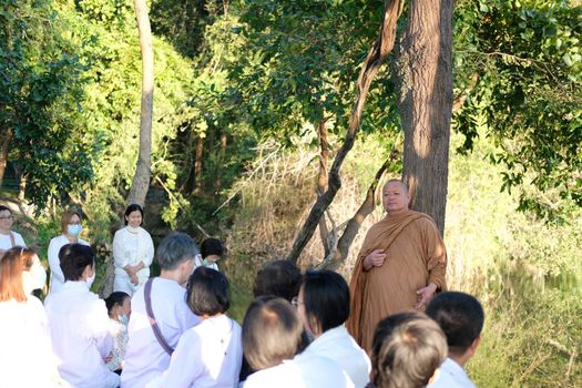 Chiang Mai, Thailand -  November 19, 2020: buddhist monk teaching dhamma to people in Chiang Mai university in Chiang Mai, Thailand on November 19, 2020.