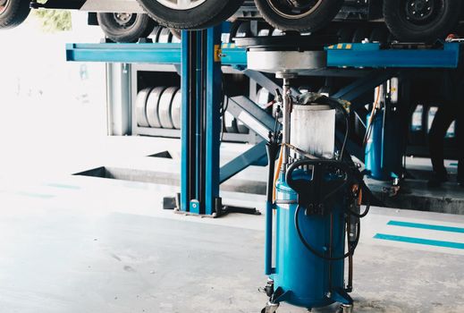 motor oil container for filling old engine oil from car in garage