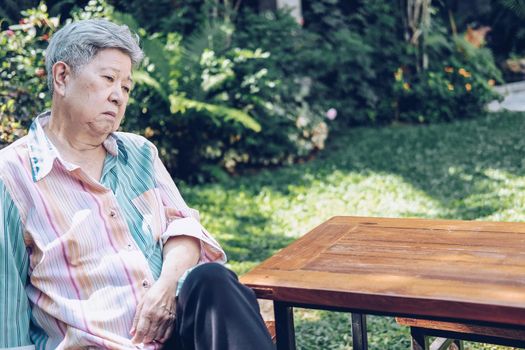 stressed depressed fatigued sad upset asian old asian elderly senior elder woman