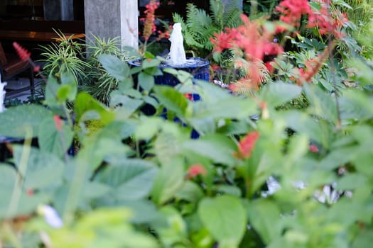 fountain on blue water jar decorating in garden
