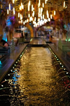 decorative light and fountain on pond abstract background