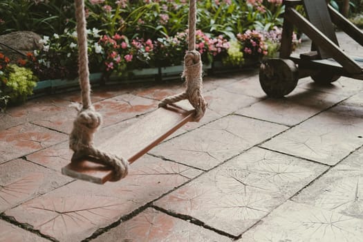 wooden swing in garden