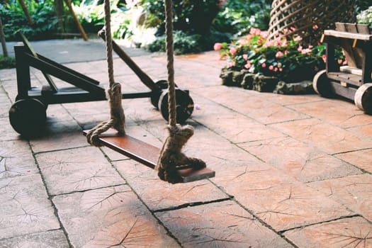 wooden swing in garden