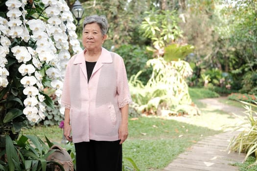 asian old elderly elder woman resting relaxing in garden. senior leisure lifestyle