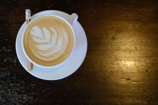 hot cappuccino mocha coffee with latte art and cinnamon.