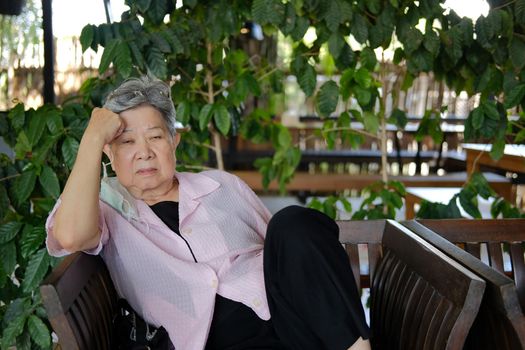 sleepy depressed fatigued sad upset asian old asian elderly senior elder woman