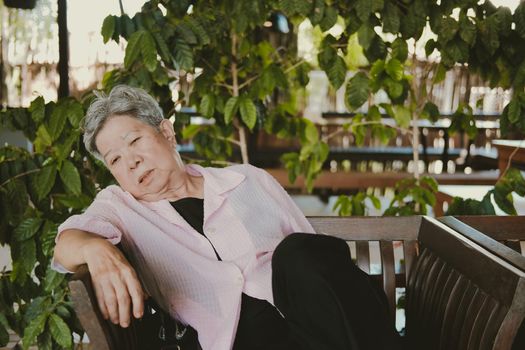 sleepy depressed fatigued sad upset asian old asian elderly senior elder woman