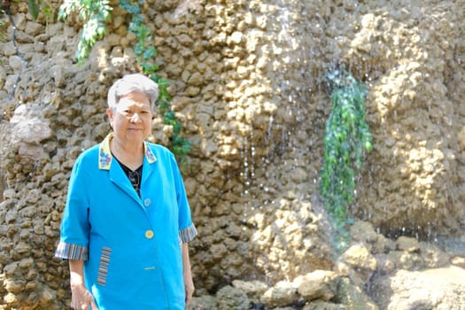 asian old elderly elder woman resting relaxing in garden. senior leisure lifestyle