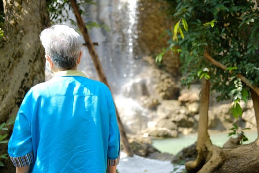 asian old elderly elder woman resting relaxing in garden. senior leisure lifestyle