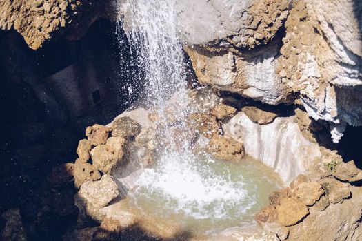 manmade waterfall park. flowing water stream