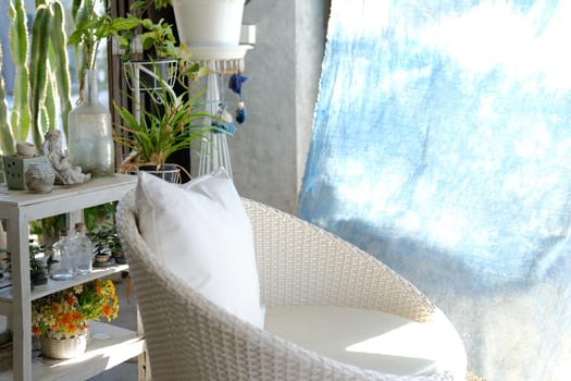 white wicker rattan chair sofa on patio at home